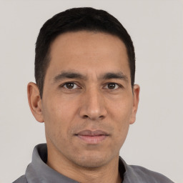 Neutral white adult male with short  black hair and brown eyes