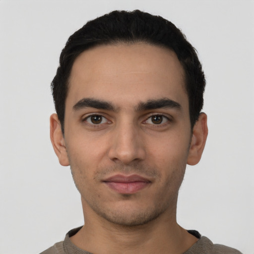 Neutral latino young-adult male with short  black hair and brown eyes