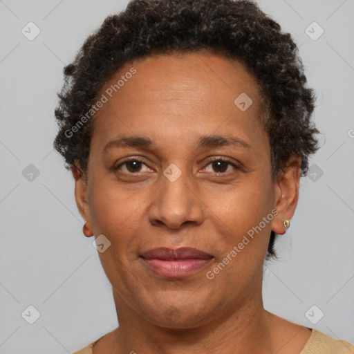 Joyful black adult female with short  brown hair and brown eyes