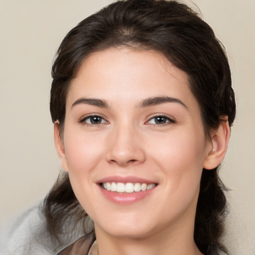 Joyful white young-adult female with medium  brown hair and brown eyes