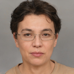 Joyful white adult female with short  brown hair and brown eyes