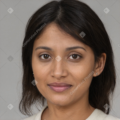 Joyful latino young-adult female with medium  brown hair and brown eyes