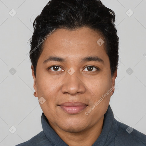 Joyful latino young-adult male with short  black hair and brown eyes