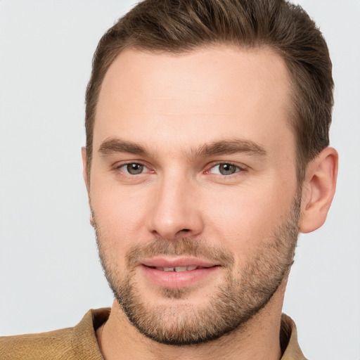 Joyful white young-adult male with short  brown hair and brown eyes