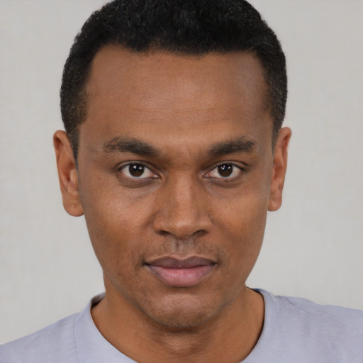 Neutral black young-adult male with short  black hair and brown eyes