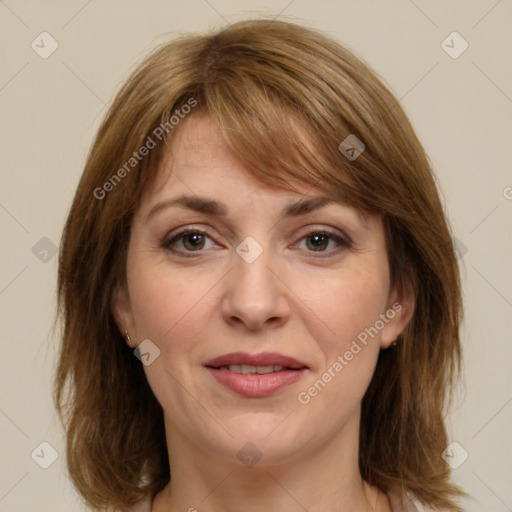 Joyful white adult female with medium  brown hair and grey eyes