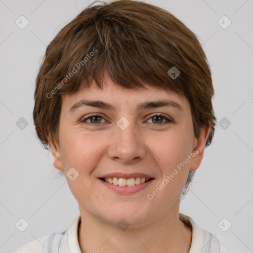 Joyful white young-adult female with short  brown hair and grey eyes