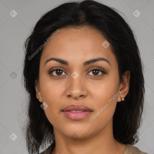 Joyful latino young-adult female with medium  brown hair and brown eyes