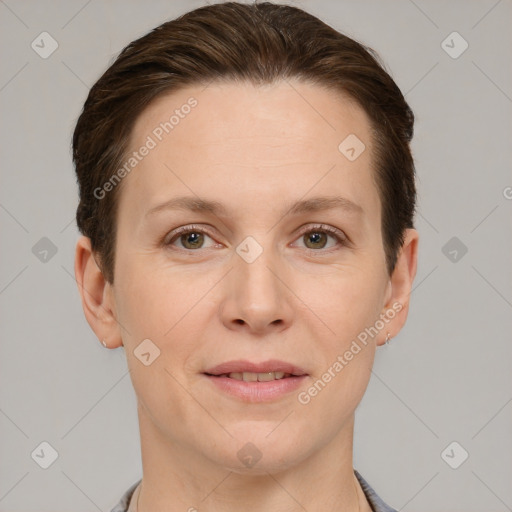 Joyful white adult female with short  brown hair and grey eyes