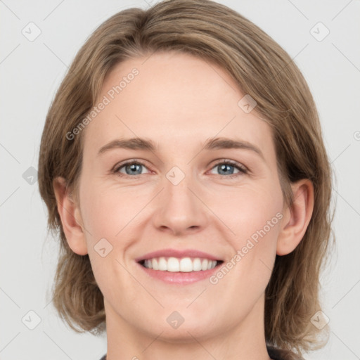 Joyful white young-adult female with medium  brown hair and grey eyes