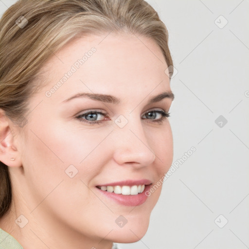 Joyful white young-adult female with medium  brown hair and blue eyes