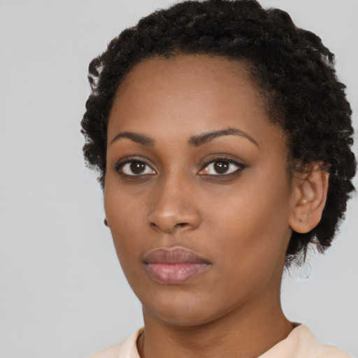 Neutral black young-adult female with short  black hair and brown eyes