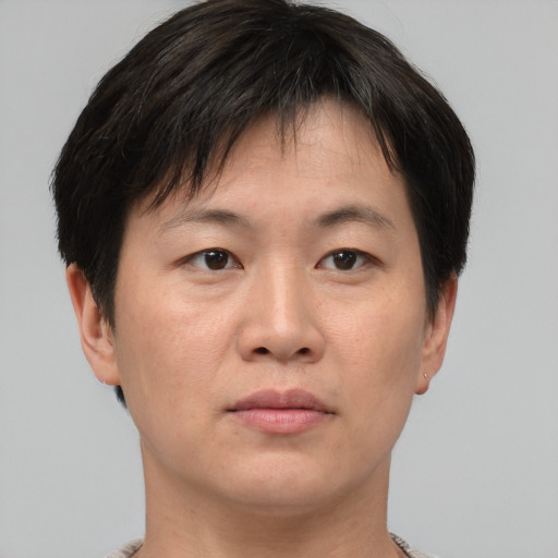 Neutral asian adult male with short  brown hair and brown eyes
