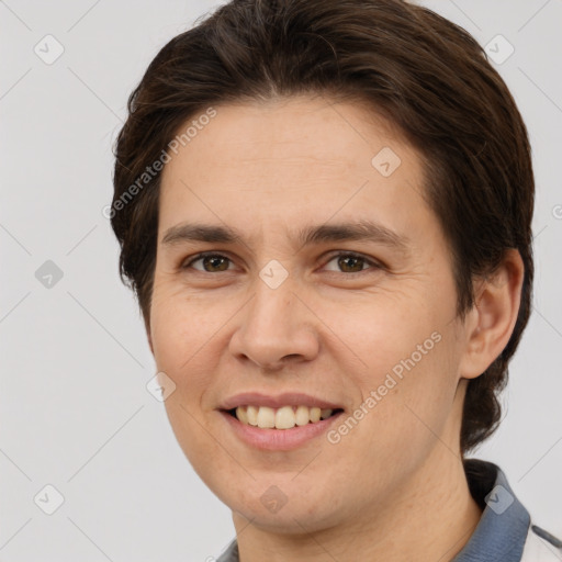 Joyful white adult female with short  brown hair and brown eyes