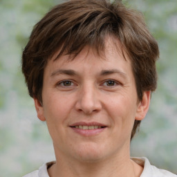 Joyful white adult female with short  brown hair and brown eyes