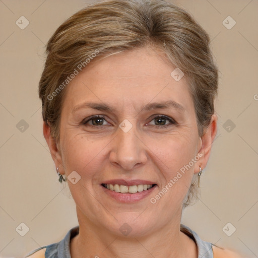 Joyful white adult female with short  brown hair and brown eyes