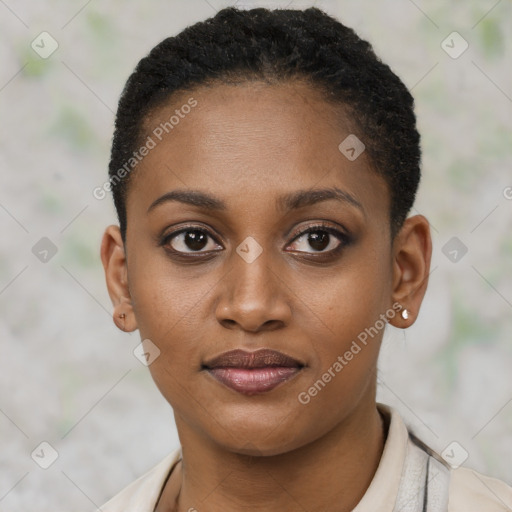 Joyful black young-adult female with short  brown hair and brown eyes