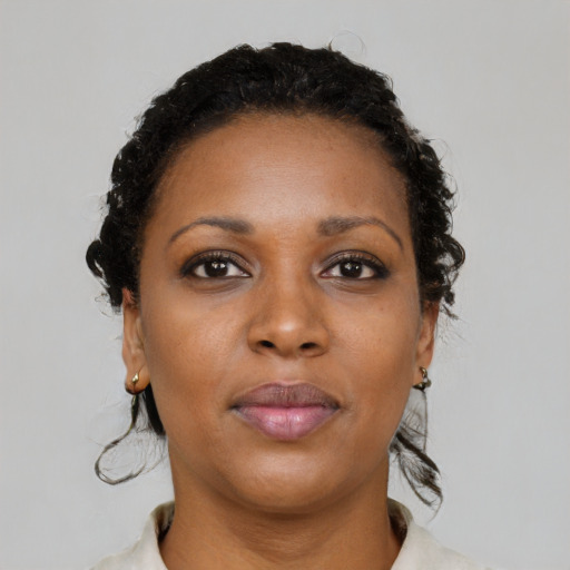 Neutral black young-adult female with medium  black hair and brown eyes