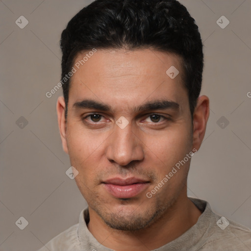 Joyful white young-adult male with short  black hair and brown eyes