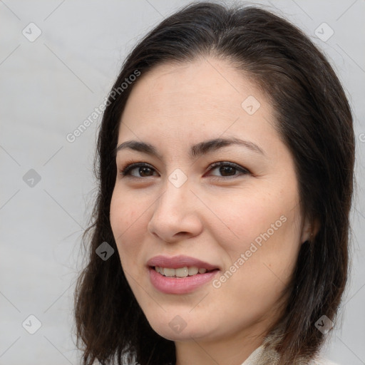 Joyful white young-adult female with long  brown hair and brown eyes