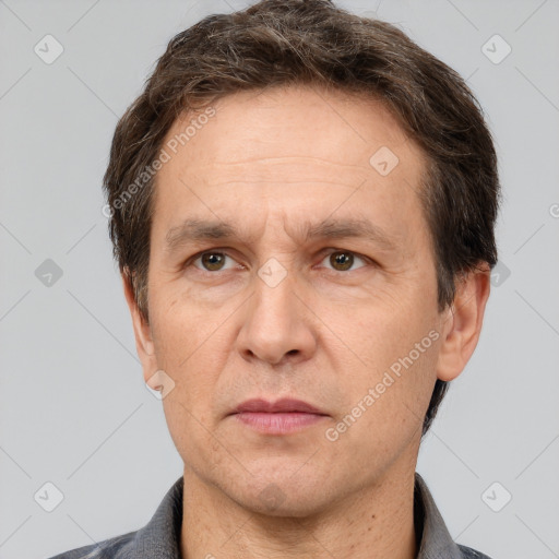 Neutral white adult male with short  brown hair and brown eyes