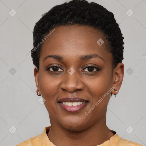 Joyful black young-adult female with short  black hair and brown eyes