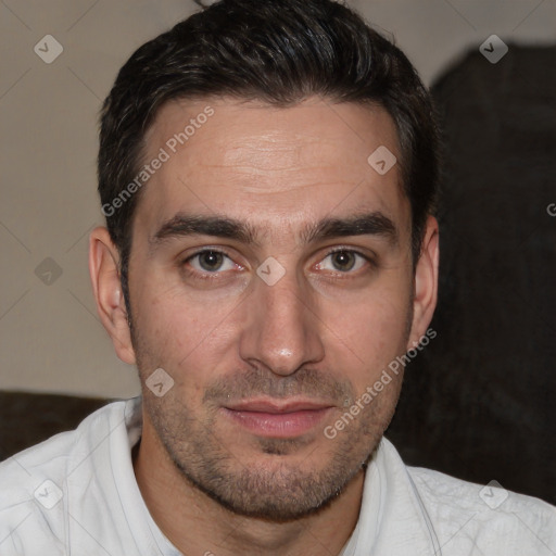 Joyful white adult male with short  brown hair and brown eyes