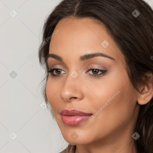 Joyful latino young-adult female with long  brown hair and brown eyes