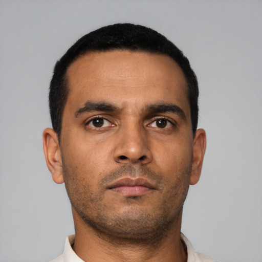 Neutral latino young-adult male with short  black hair and brown eyes