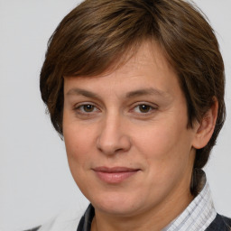 Joyful white adult female with medium  brown hair and brown eyes