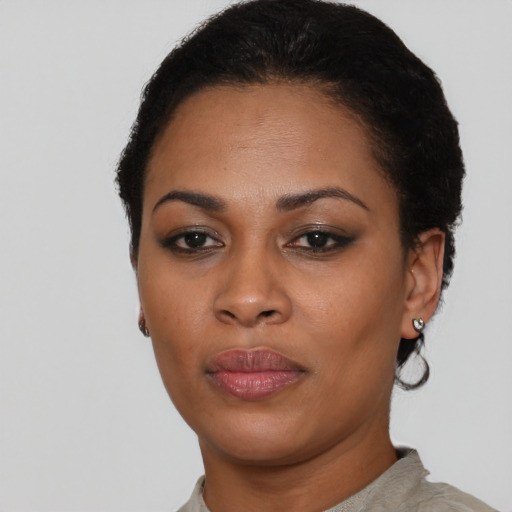 Neutral latino young-adult female with short  black hair and brown eyes