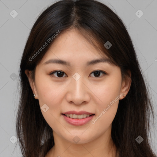 Joyful asian young-adult female with long  brown hair and brown eyes