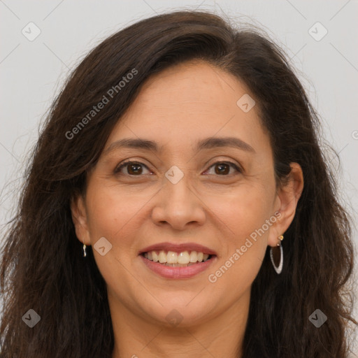 Joyful white adult female with long  brown hair and brown eyes