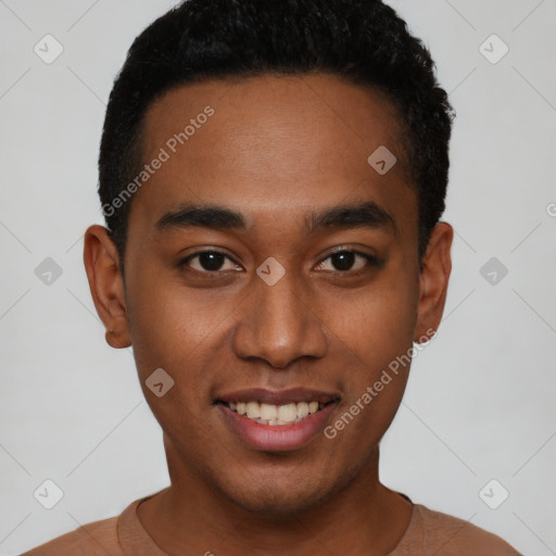 Joyful black young-adult male with short  black hair and brown eyes