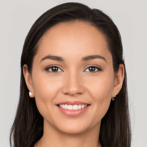 Joyful white young-adult female with long  brown hair and brown eyes