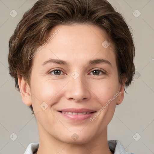 Joyful white young-adult female with short  brown hair and grey eyes