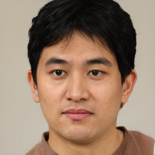 Neutral asian young-adult male with short  black hair and brown eyes