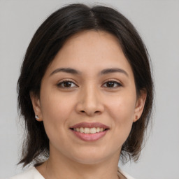 Joyful white young-adult female with medium  brown hair and brown eyes