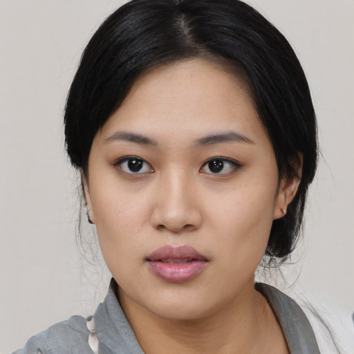Neutral asian young-adult female with medium  black hair and brown eyes