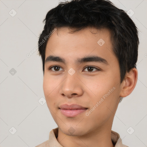 Joyful asian young-adult male with short  black hair and brown eyes