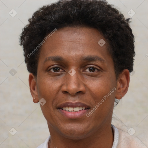 Joyful black adult male with short  brown hair and brown eyes