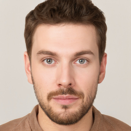 Neutral white young-adult male with short  brown hair and grey eyes