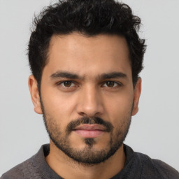 Neutral latino young-adult male with short  brown hair and brown eyes