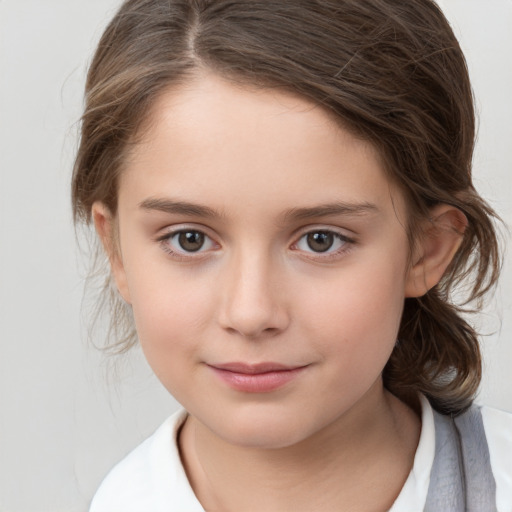 Joyful white child female with medium  brown hair and brown eyes