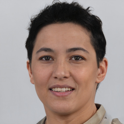 Joyful white young-adult female with short  black hair and brown eyes