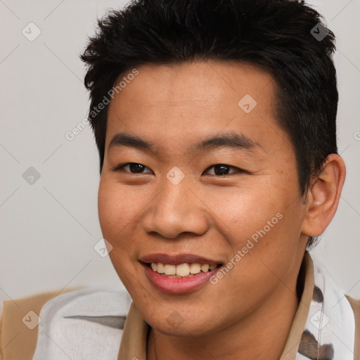 Joyful asian young-adult male with short  brown hair and brown eyes