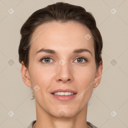 Joyful white young-adult female with short  brown hair and grey eyes