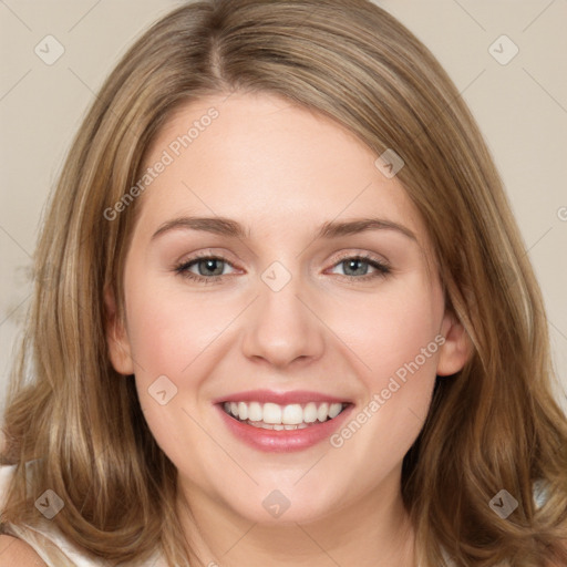 Joyful white young-adult female with long  brown hair and green eyes