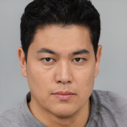 Neutral asian young-adult male with short  black hair and brown eyes