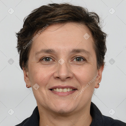 Joyful white adult female with short  brown hair and brown eyes